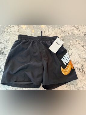 Nike Black Kids Swim Trunks with Swoosh Graphic